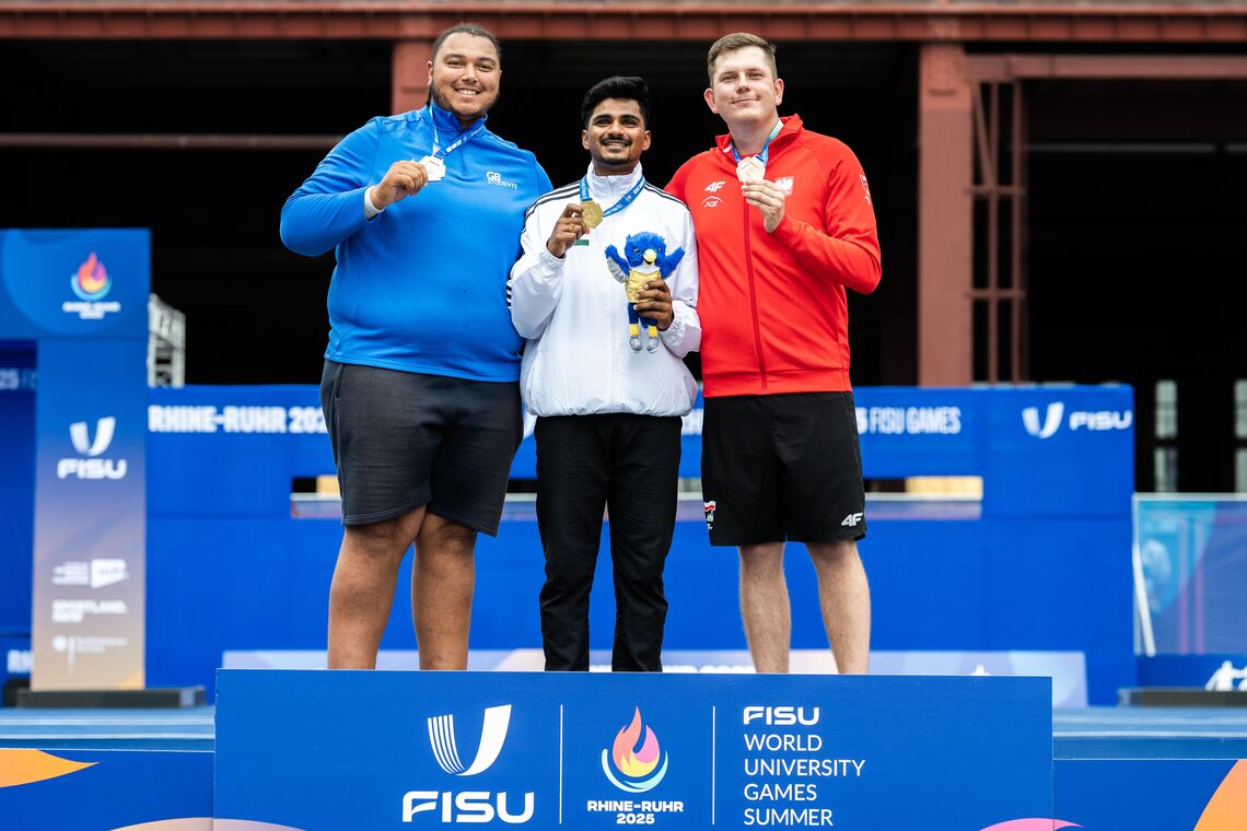 Ajay Scott (silver) Sahil Rajesh Jadhav (gold) and Przemyslaw Konecki (bronze) on the podium.
