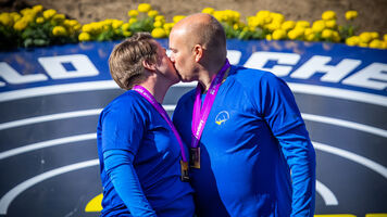 Lina Bjorklund and Erik Jonsson celebrate winning pairs world title.