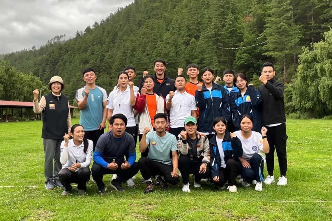Coach Sally with the Bhutan national archery team.