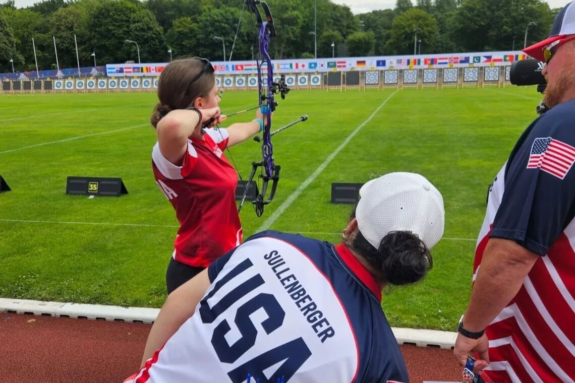 Brynnleigh Lohner testing out borrowed bow at 2025 University Games.